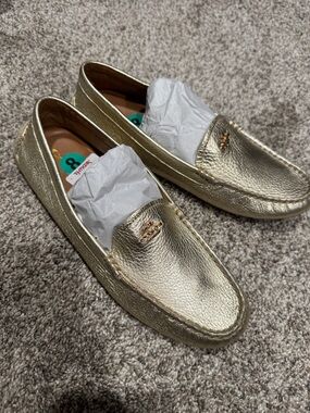 NWT Coach women’s, gold Loafers, size 8